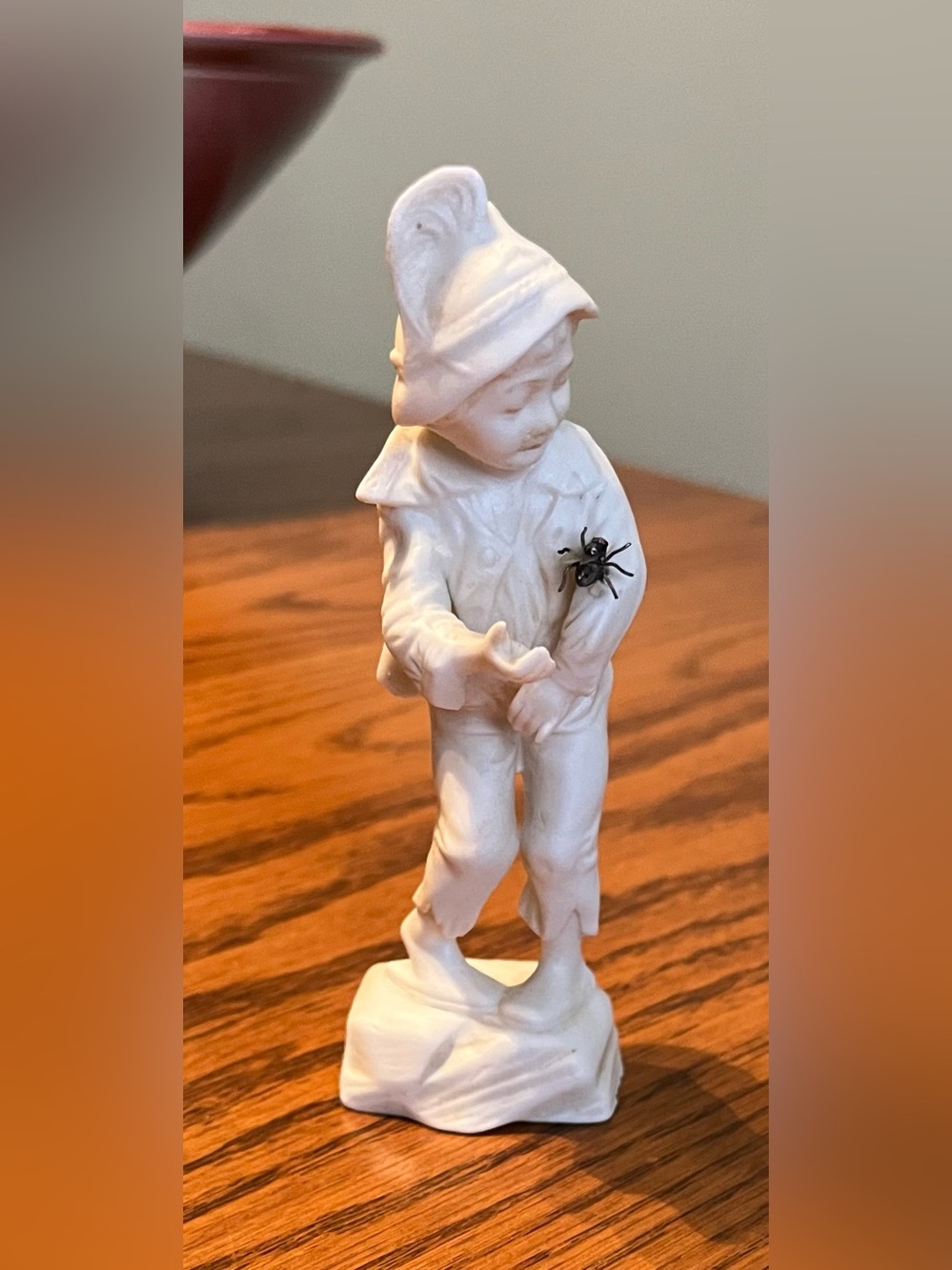 Boy with Fly Bisque Statue